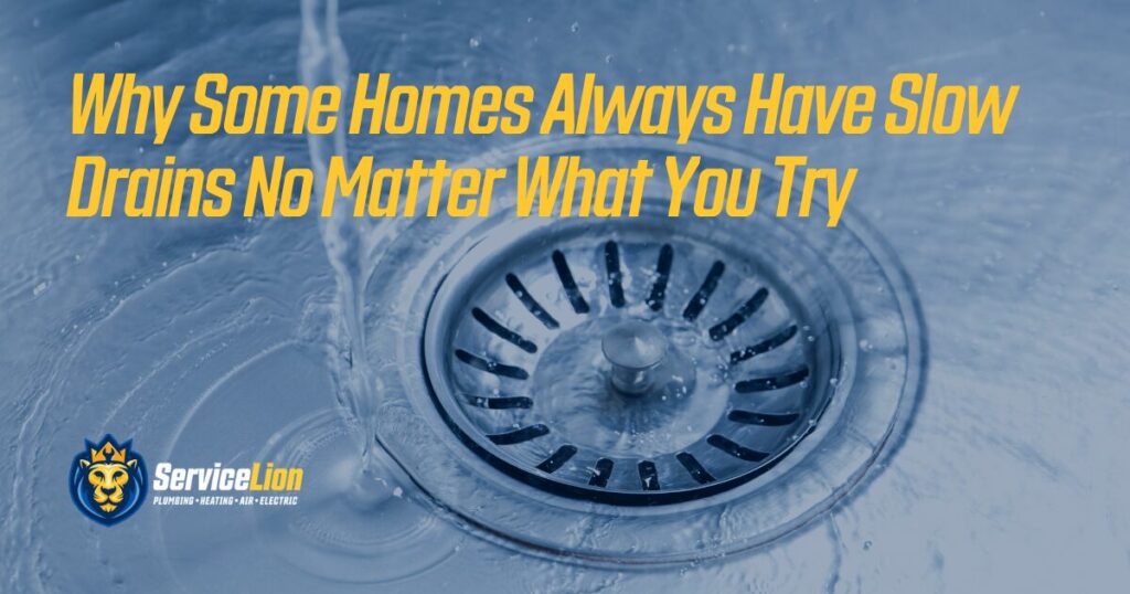 A metal sink drain with water swirling around, overlaid with the text: "Why Some Homes Always Have Slow Drains No Matter What You Try," highlighting common home plumbing drain problems, and the ServiceLion logo.